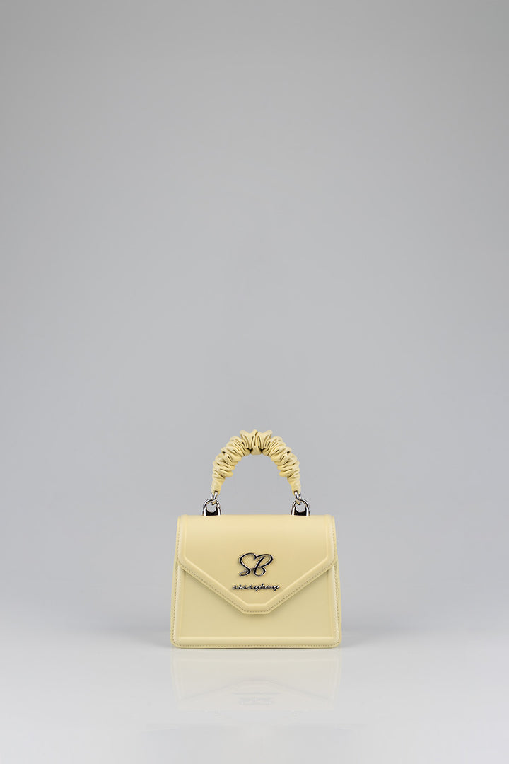 Primrose Mini Bag With Pompom Strap - Butter Yellow