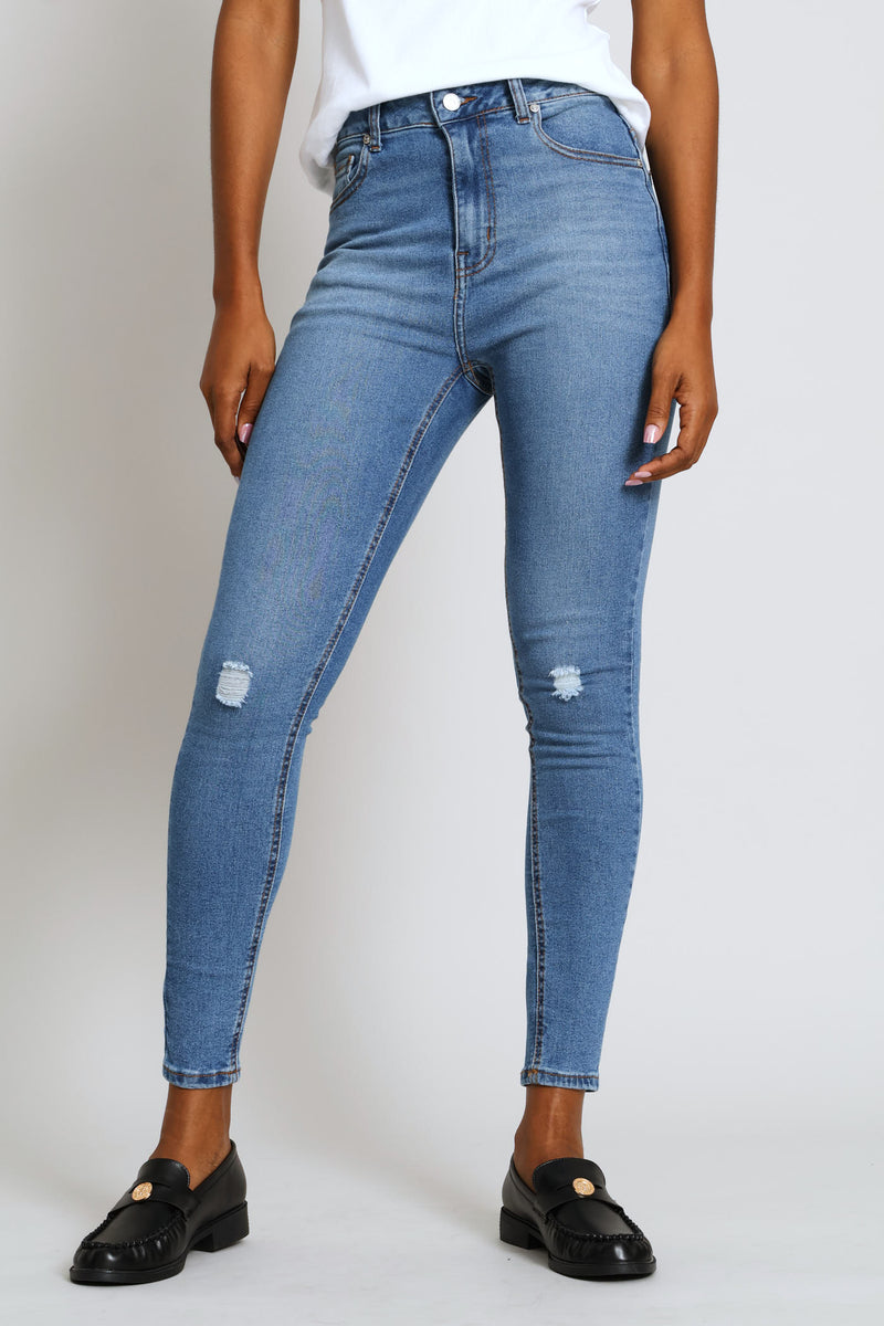 Hi-Rise Abraised Knee Rip Skinny Denim - Medium Wash