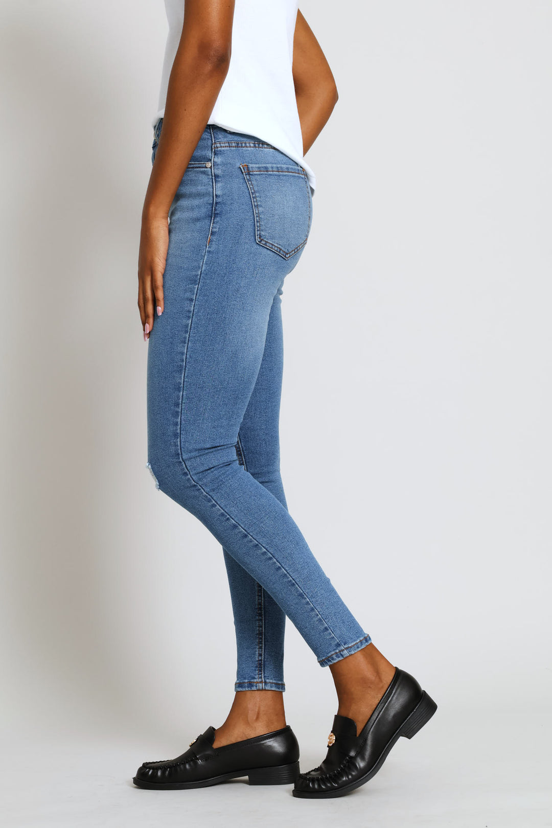 Hi-Rise Abraised Knee Rip Skinny Denim - Medium Wash