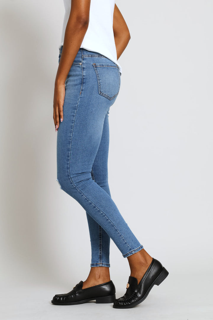 Hi-Rise Abraised Knee Rip Skinny Denim - Medium Wash