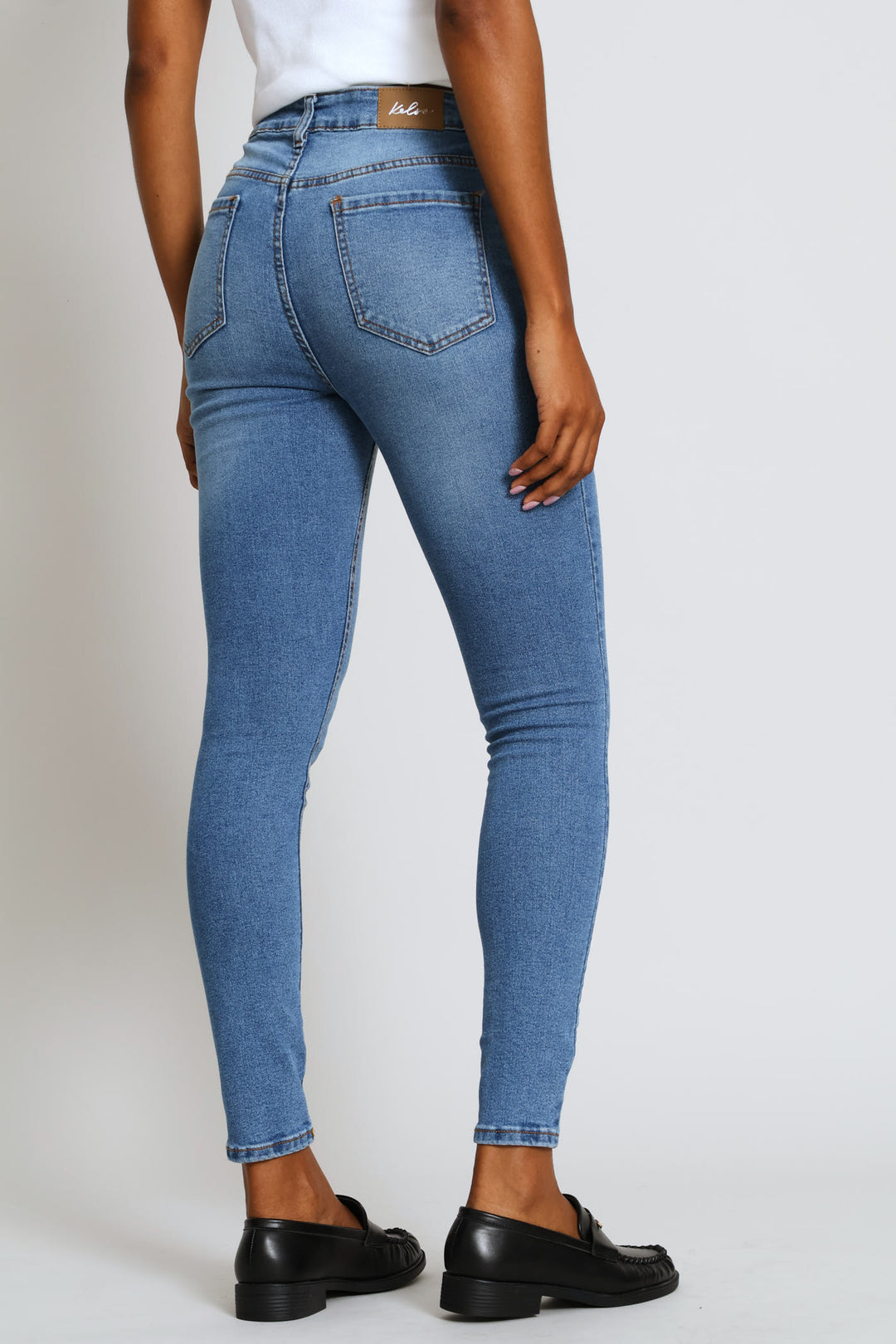 Hi-Rise Abraised Knee Rip Skinny Denim - Medium Wash