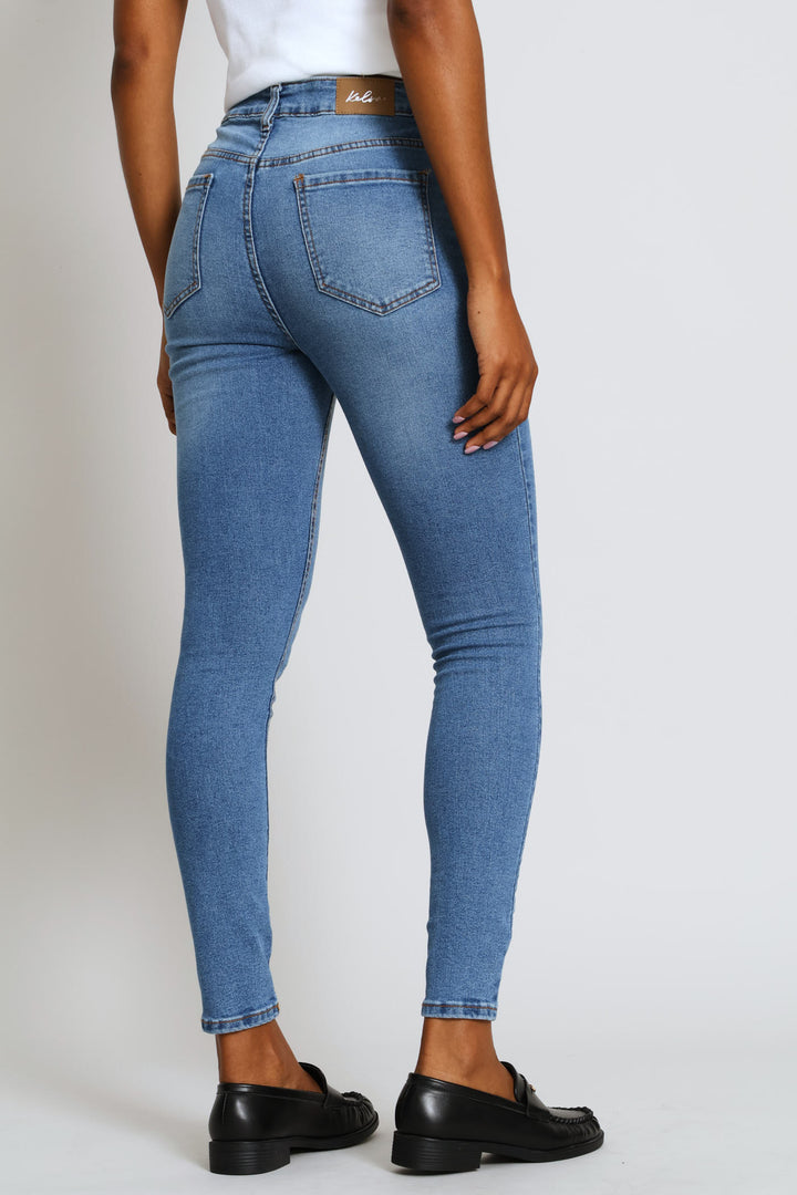 Hi-Rise Abraised Knee Rip Skinny Denim - Medium Wash